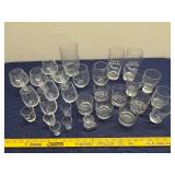 Collection of Assorted Glassware Including Tumblers, Mugs, and Stamped Bar Glasses
