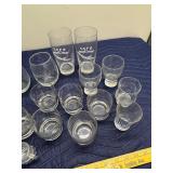 Collection of Assorted Glassware Including Tumblers, Mugs, and Stamped Bar Glasses