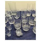 Collection of Assorted Glassware Including Tumblers, Mugs, and Stamped Bar Glasses