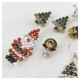 Lot of 7 Vintage Holiday Brooches and Pins - Christmas Tree, Santa, Snowflake, Angel, and Music Note Designs