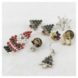 Lot of 7 Vintage Holiday Brooches and Pins - Christmas Tree, Santa, Snowflake, Angel, and Music Note Designs