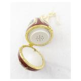 Mr. Christmas Hinged Egg Ornament with Tree and Presents Design
