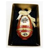 Red Porcelain Musical Egg Ornament with Holly and Bell Design