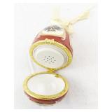 Red Porcelain Musical Egg Ornament with Holly and Bell Design