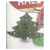 Assorted Christmas Holiday Decor Lot with Signs, Santa Hat, and Wreath