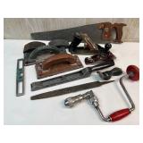Collection of Vintage Woodworking Hand Tools Including Planes, Saws, and Files