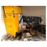 Cabinet of Mixed Industrial Parts Including Oil Filters, Pistons, Bearings, and Hardware