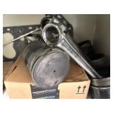 Cabinet of Mixed Industrial Parts Including Oil Filters, Pistons, Bearings, and Hardware
