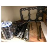 Cabinet of Mixed Industrial Parts Including Oil Filters, Pistons, Bearings, and Hardware