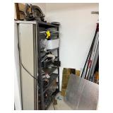 Workshop Equipment and Material Collection with Hand Tools, Shelving, Metal Sheets, and Clamps