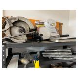 Workshop Equipment and Material Collection with Hand Tools, Shelving, Metal Sheets, and Clamps