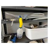 Workshop Equipment and Material Collection with Hand Tools, Shelving, Metal Sheets, and Clamps