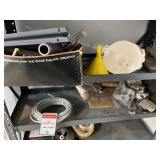 Workshop Equipment and Material Collection with Hand Tools, Shelving, Metal Sheets, and Clamps