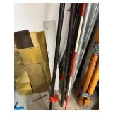 Workshop Equipment and Material Collection with Hand Tools, Shelving, Metal Sheets, and Clamps