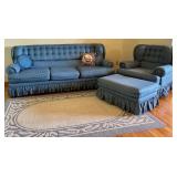 Blue Upholstered Sofa, Chair, and Ottoman Set with Skirted Detailing and Area rug