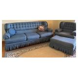 Blue Upholstered Sofa, Chair, and Ottoman Set with Skirted Detailing and Area rug