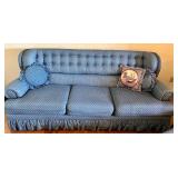 Blue Upholstered Sofa, Chair, and Ottoman Set with Skirted Detailing and Area rug
