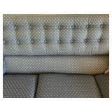 Blue Upholstered Sofa, Chair, and Ottoman Set with Skirted Detailing and Area rug