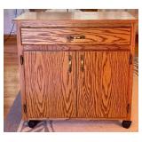 Rolling Oak Storage Cabinet with Drawer and Shelves