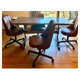 Dining Table with Wood Grain Finish and 4 Rolling Chairs
