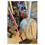 Collection of Garden and Lawn Tools including Shovels, Rake, Brooms, and Pruner