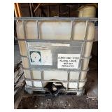 Used oil container and two barrels