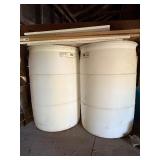 Used oil container and two barrels