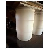 Used oil container and two barrels