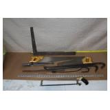 Collection of Hand Tools Including Saws, Crowbars, and Square