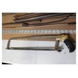 Collection of Hand Tools Including Saws, Crowbars, and Square