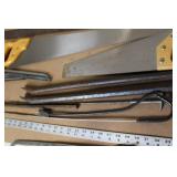 Collection of Hand Tools Including Saws, Crowbars, and Square