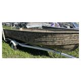 Camoflauge 16’ tiller boat with NO motor on bunk trailer.