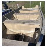 Camoflauge 16’ tiller boat with NO motor on bunk trailer.