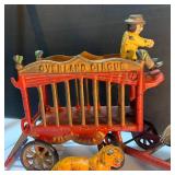 Whimsical Pinata Artwork, Cast Iron Circus Truck, and toys.