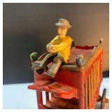 Whimsical Pinata Artwork, Cast Iron Circus Truck, and toys.
