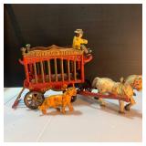 Whimsical Pinata Artwork, Cast Iron Circus Truck, and toys.