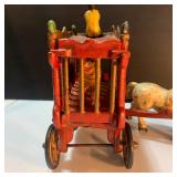 Whimsical Pinata Artwork, Cast Iron Circus Truck, and toys.