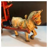 Whimsical Pinata Artwork, Cast Iron Circus Truck, and toys.