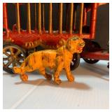 Whimsical Pinata Artwork, Cast Iron Circus Truck, and toys.