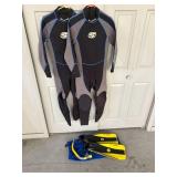 Two Medium Wet Suits, fins and snorkle.