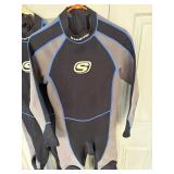 Two Medium Wet Suits, fins and snorkle.