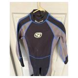 Two Medium Wet Suits, fins and snorkle.
