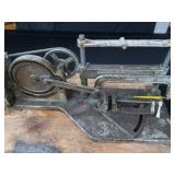 POWER HACK SAW ON HEAVY DUTY WOOD BENCH.