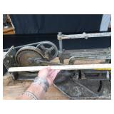 POWER HACK SAW ON HEAVY DUTY WOOD BENCH.