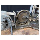 POWER HACK SAW ON HEAVY DUTY WOOD BENCH.