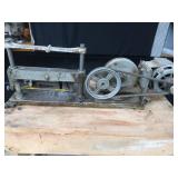 POWER HACK SAW ON HEAVY DUTY WOOD BENCH.