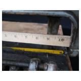 POWER HACK SAW ON HEAVY DUTY WOOD BENCH.