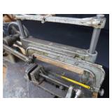 POWER HACK SAW ON HEAVY DUTY WOOD BENCH.
