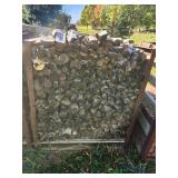 Stack of Seasoned Firewood for Heating or Outdoor Use