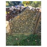 Stack of Seasoned Firewood in Metal Rack